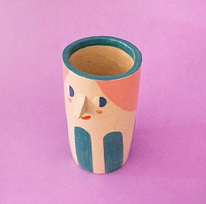 Girl with teal stripes vase